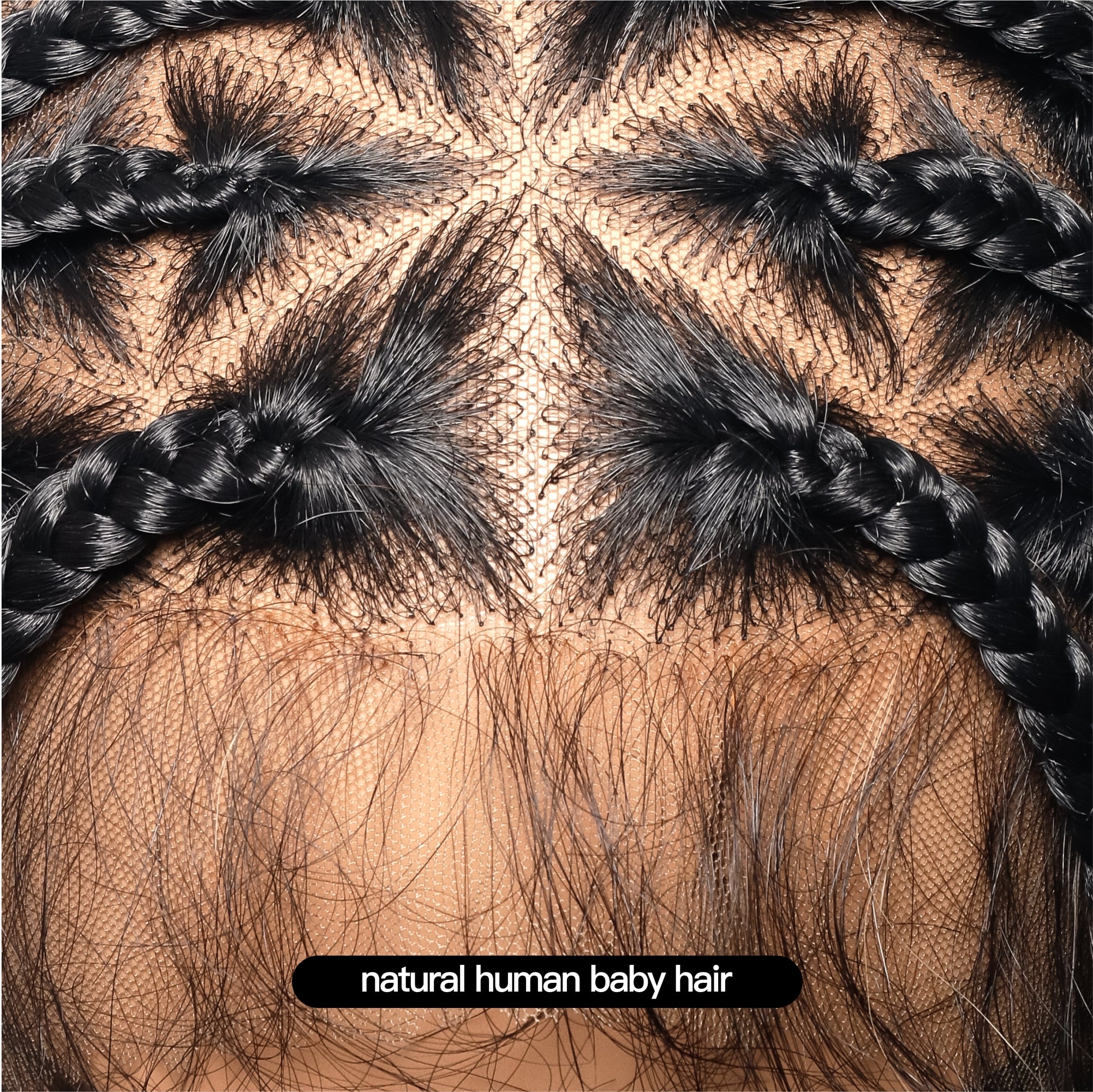 Close-up of the JALIZA black knotless boho box braided wig lace front, showing natural human baby hair along the hairline and a triangle base with neat braided parts.
