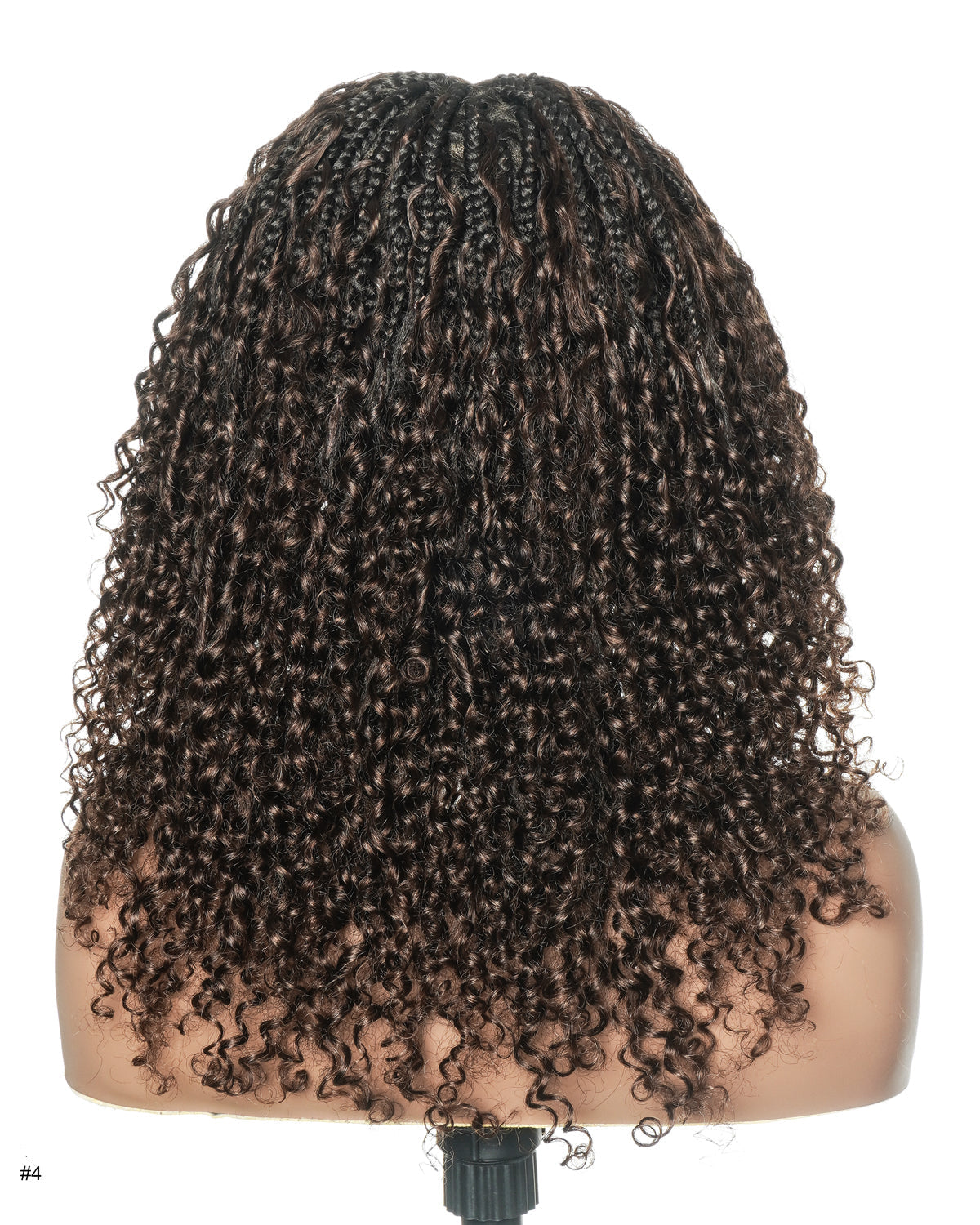 Mannequin head with curly hair extensions on a white background