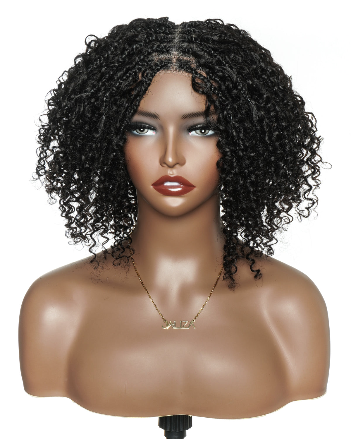 Mannequin head with a black curly wig on a white background
