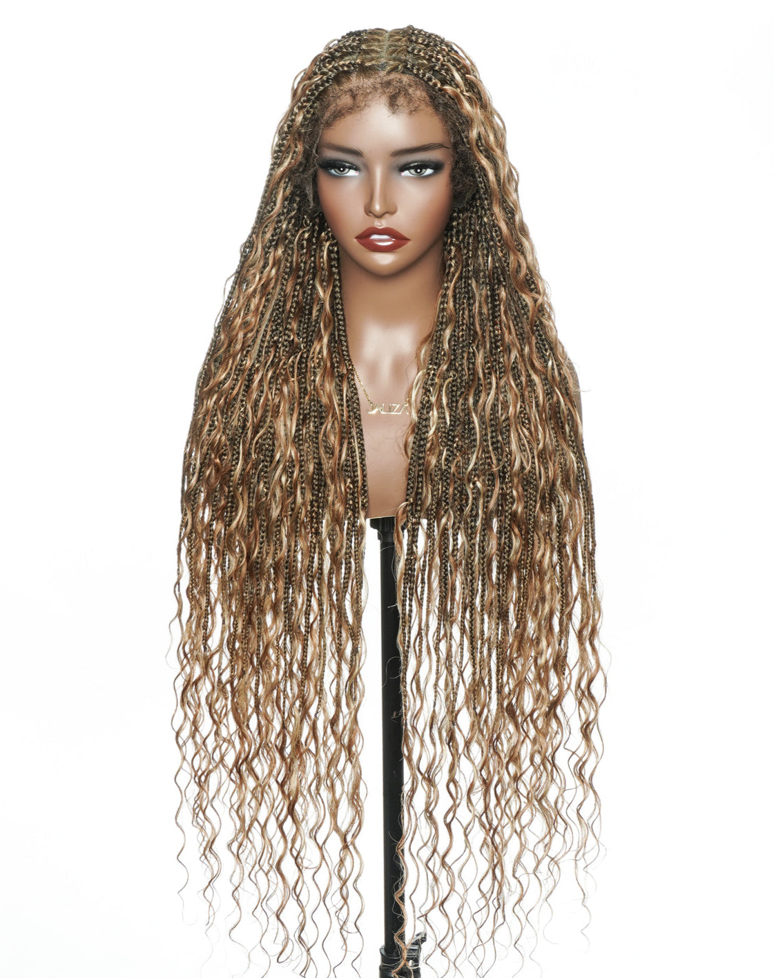 Mannequin head with long, wavy, braided hair on a white background