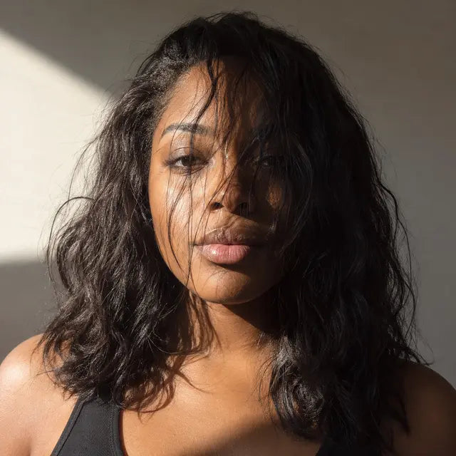 Photo with hair and shadow covering the face to avoid